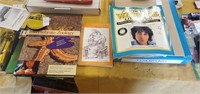 Lot of books and paper weight