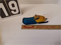 Old AVON blue and yellow glass snowmobile.