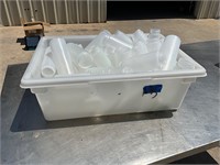 Plastic tub with squeeze bottle