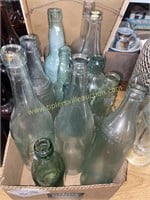 Box of wine and soda bottles