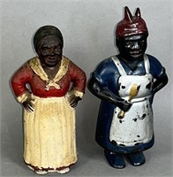 2 black Americana iron figural banks ca.