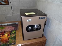 SMALL SAFE WITH COMBINATION LOCATED IN BASEMENT