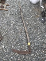 Antique sickle blade is rusted but intact, charmin