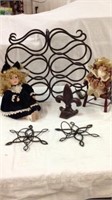 Metal wine rack with porcelain dolls star candle