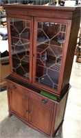 Small glass door China cabinet top is securely