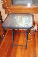 Small outdoor glass and metal table