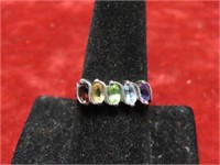 Sterling silver ring. W/ multi color stones. Size