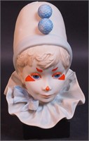 A Cybis bust of a young girl, Funny Face, on wood