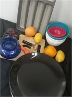 Group of dishes, bowls, fake fruit, silverware