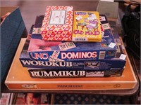 Group of games including Parcheesi, Rummikub,