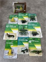 John Deere toy tractor and farm equipment. All