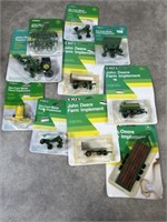 ERTL John Deere toy tractor and farm equipment.