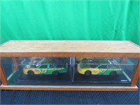 2 cars in display case 32x8x10
