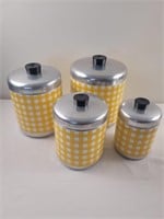 Aluminum canisters with yellow and white accents