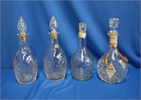 Four glass decanters, 11.75 X 10"H