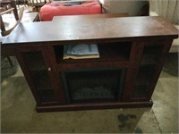 Entertainment center with electric fireplace.