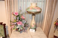 Antigue lamp and flower arrangement