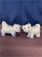 Pair of blue white cow figurines