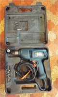Black and Decker 10mm electric drill with bits.