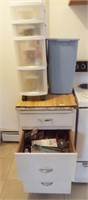 Three drawer cupboard with various kitchen and