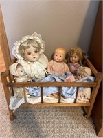 Wooden cradle with five dollies