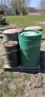 Assorted empty barrels on pallet