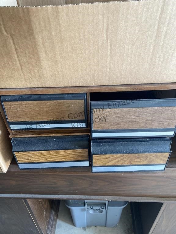 2 storage boxes for vhs tapes and a few vhs