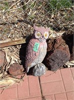 Garden owl behind shed