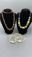 Three costume jewelry necklaces