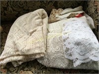 assorted lace table cloths doillies