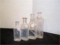 4 vintage clear glass bottles