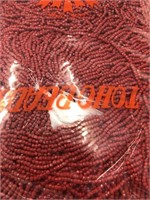 Toho 12/0 cut beads dark red.
