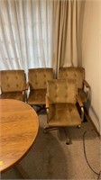 Dining room table and 4 chairs on rolloers