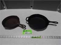 2 Cast iron skillets; larger one is Lodge