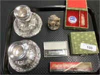 Harmonicas, silver plate candleholders, stamper.