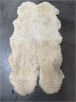 Sheepskin rug, 
75” x 40”