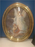 Oval framed print of an Angel overlooking
