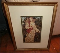 gold framed print of woman in floral dress