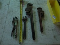 4- 2 pipe wrenches and 2 crescent wrenches