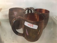 3 copper mugs