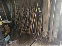 Multiple yard and garden hand tools.