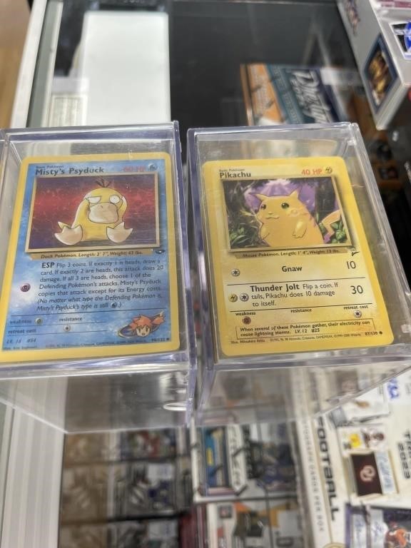 2 PLASTIC CASES WITH EARLY POKEMON CARDS OVER 700