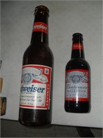 1 PLASTIC AND 1 GLASS LARGE BUDWEISER BOTTLES
