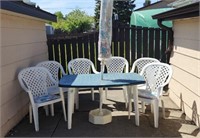 Patio Table, 6 plastic chairs & Umbrella.