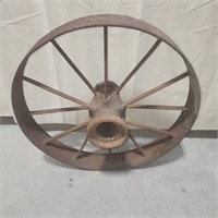 Antique farm implement wheel