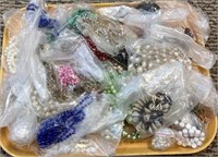 Tray filled with costume necklaces - each
