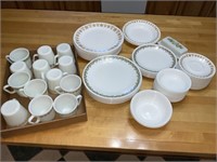 Mixed green and yellow Pyrex cups and Corelle
