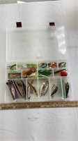 Fishing accessories in plastic tackle box
