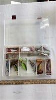 Fishing accessories in plastic tackle box