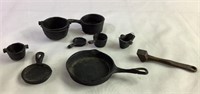 Lot of miniature cast-iron pots and pans